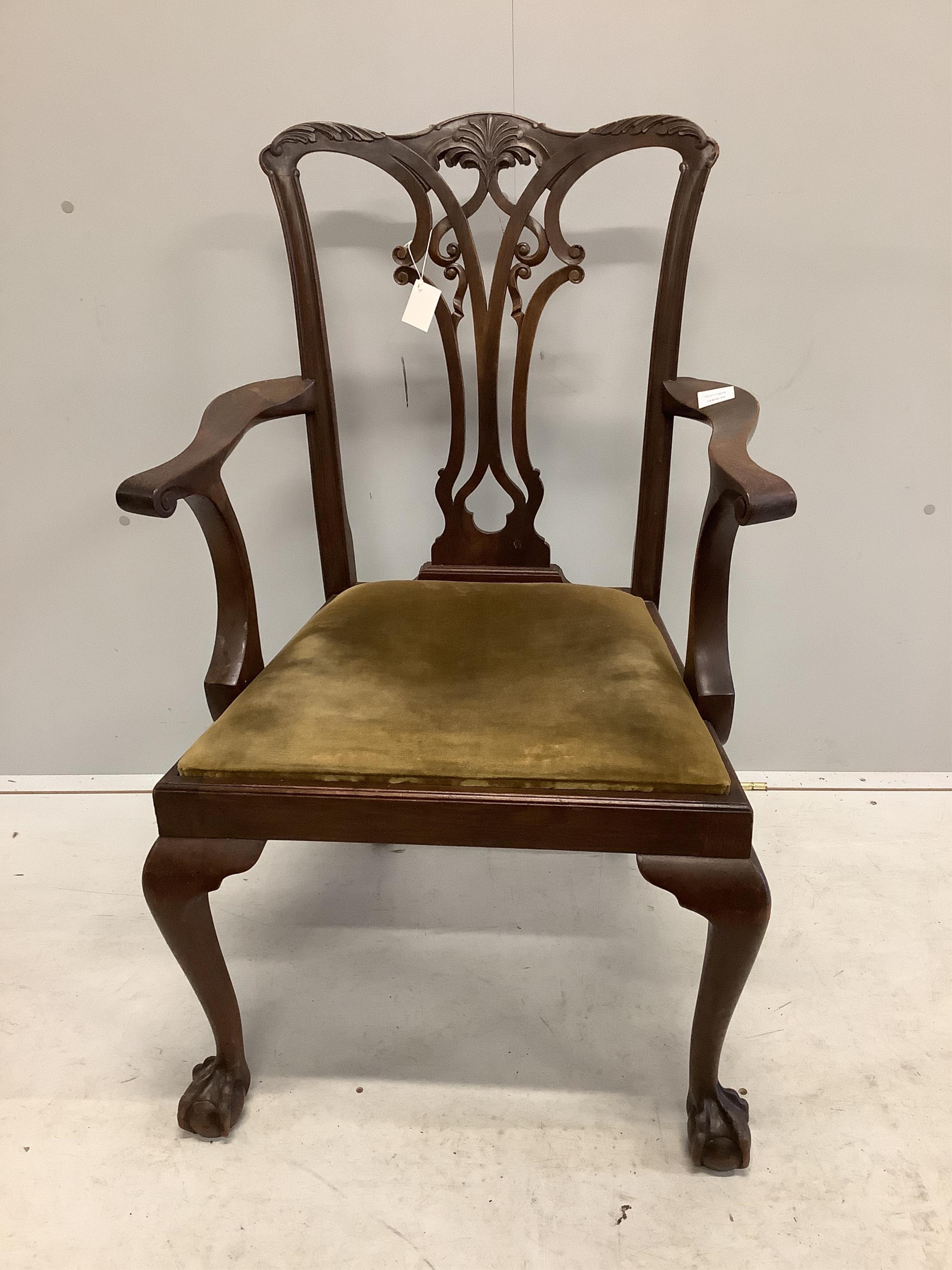 A George III Chippendale style mahogany elbow chair with a later similar elbow chair. Condition - fair